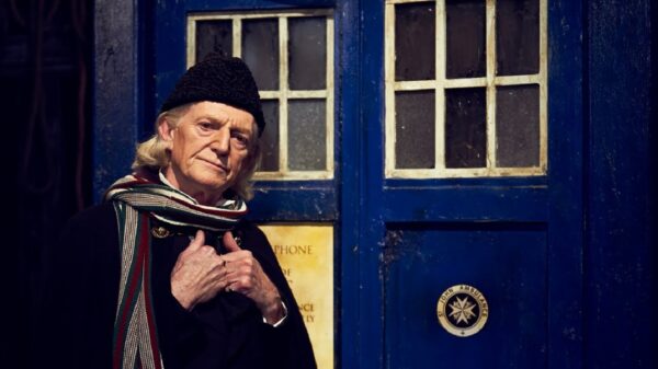 David Bradley as William Hartnell (the First Doctor) in front of the TARDIS
