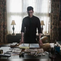 Joseph Morgan stood at a Victorian desk in Herbert West: Reanimator